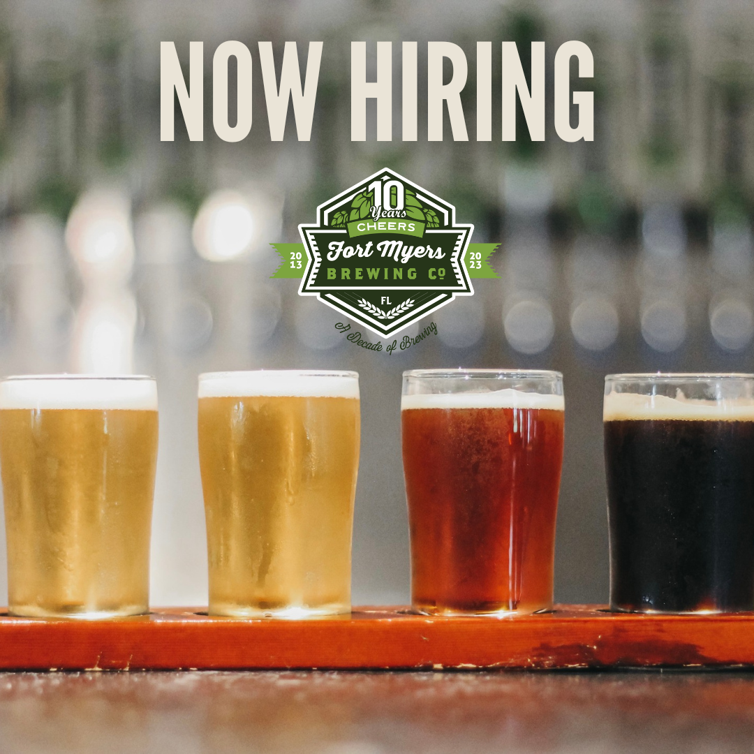 a row of beers on a tray with the words "now hiring" amplifies job opportunities in a festive setting.